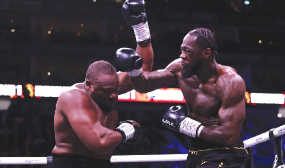Deontay Wilder and Derek Chisora in a fierce exchange during last Saturday's showdown in London