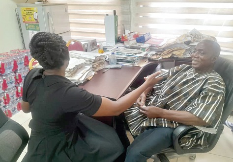 Isaac Esau (right), Deputy General Secretary in charge of Administration of the Ghana Private Road Transport Union, speaking to Beatrice Laryea, a Reporter with the Daily Graphic