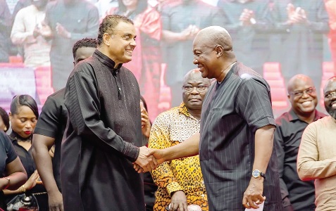 President John Dramani Mahama (right) exchanging pleasantries with Bishop Dag Heward-Mills during the service