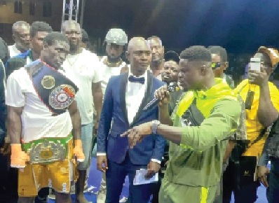 Rematch demanded — Freezy Macbones (right) storms the ring after Jonathan Tetteh’s victory, calling for a Kumasi showdown