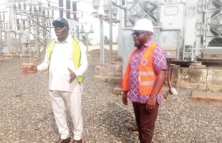 Francis Kofi Atsyatsya (left), ECG General Manager in charge of Subtransmissions Operations in Accra Area, explaining the nature of the work to be undertaken. With him is Dr Charles Nii Ayiku Ayiku, acting Director of Communication, ECG