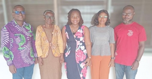 Prof. Akua Opokua Britwum (2nd from left), Chairperson, National Media Commission; Rev. Isaac Owusu  (left), member of NMC, with the staff of Cape Coast office of the Graphic Communications Group Ltd