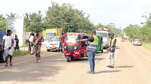 Staff of the NRSA carrying out sensitisation and enforcement of road safety regulations