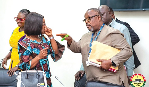 Abena Osei-Asare, Chairperson of the Public Accounts Committee, conferring with Samuel Atta-Mills, Ranking Member of PAC