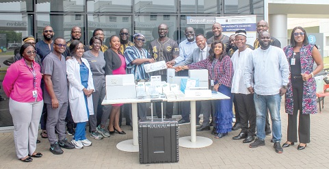 Kwabena Jumah (6th from right), Member, Alpha Phil Apha Fraternity, donating the equipment to Dr Abdul-Samed Tanko (6th from left), CEO, UGMC. Looking on are some members of Apha Phil Alpha Fraternity and other officials of UGMC. Picture: ERNEST KODZI 