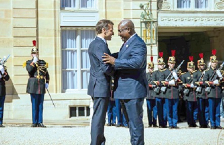 President Mahama  and President Emmanuel Macron in a warm embrace