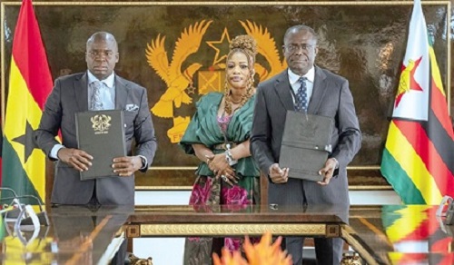 Joseph Siaw Agyepong (right), Executive Chairman of JGC, and Dr Dilesh Nguwaya,   CEO/Executive Chairman of Geo Pomona Waste Management, displaying the MoU. With them is Adelaide Araba Siaw Agyepong, CEO, African Agribusiness Consortium Ltd