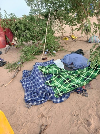 Bodies of some of the victims of the Volta Lake canoe disaster lie covered as community members prepare for their burial in line with Islamic customs.