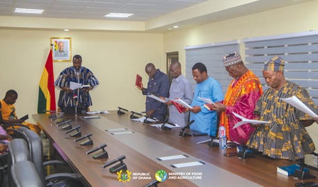 John Setor Dumelo (head of table), Deputy Food and Agric Minister, administering the oath of office