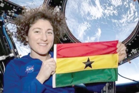 Christina Koch, NASA Astronaut, showing off the Ghana flag
