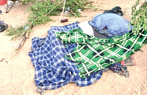 Covered bodies of some of the victims of the Volta Lake canoe disaster 