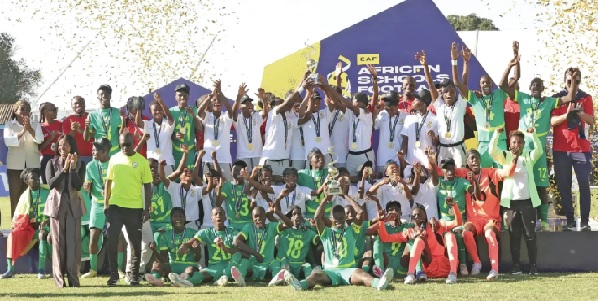 Players and officials of Ghana's black Damsels celebrating with their Senegal's players and officials during the presentation ceremony