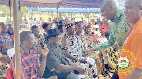 Maxwell Kwame Lukutor (2nd from right), MP for South Tongu, exchanging pleasantaries with chiefs during one of his visits