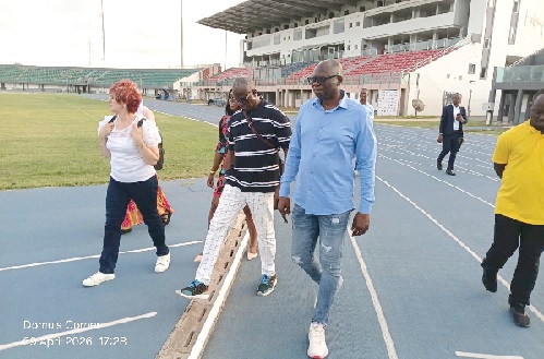 Ghana Athletics chief Bawah Fuseini (left) joins officials from the Confederation of African Athletics during an inspection tour of facilities at the University of Ghana Stadium