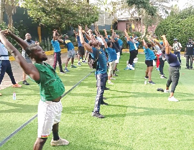Officials of the fintech giants undergoing strecthing excercise after the health walk