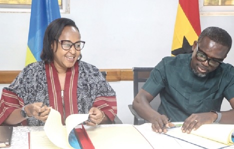 Prof. Francis Otoo (right), Director-General  of the NRA, and Rosemary Mbabazi, Rwandan Ambassador to Ghana, signing the documents