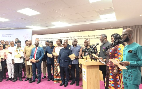 Maame Afua Houadjeto (2nd from right), CEO, Ghana Tourism Authority, swearing in committee members to support the implementation of GHATOF’s programmes 