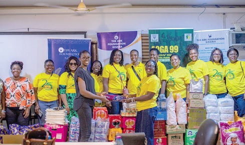 Euphemia  Serwaa Afful Asante (right), President of the 1999 year group, presenting the items to Ewurabena Jones (left), Programmes Manager of Ark Foundation