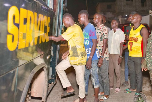 Some foreign nationals from neighbouring West African countries being escorted to board the Ghana Immigration Service bus