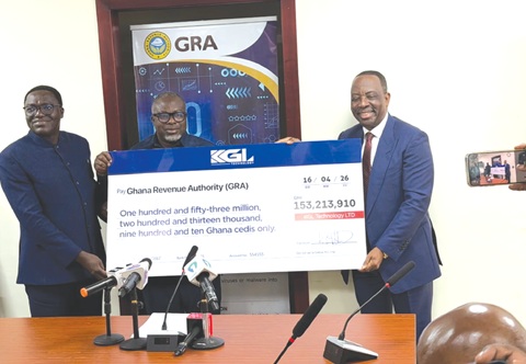 Alex Apau Dadey (right), Executive Chairman, KGL Group, presenting a dummy cheque to Anthony Kwasi Sarpong (middle), Commissioner-General, Ghana Revenue Authority