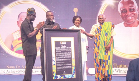 Vice-President Prof. Naana Jane Opoku-Agyemang (2nd from right) and Chief Justice Paul Baffoe-Bonnie (2nd from left) presenting a citation to Tsatsu Tsikata (right), Legal Practitioner. Applauding is Prof. Kofi Abotsi (left), Dean, UPSA Law School. Picture: ERNEST KODZI