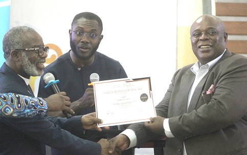  Koku Anyidoh (right), Executive Director of the Mills Institute, receiving his certificate after the training. Picture: ESTHER ADJORKOR ADJEI