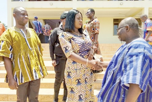 Justin Bayor (right), Head of Programmes at ActionAid Ghana, exchanging pleasantries with Charity Gardiner, Ahafo Regional Minister, after the launch of the project