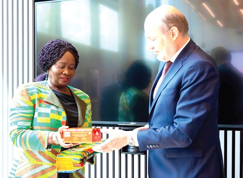 Vice-President Prof. Naana Jane Opoku-Agyemang (left) presenting a kente stole and a box of chocolates to Vicenç Bosch (right), CEO of GBfoods Africa