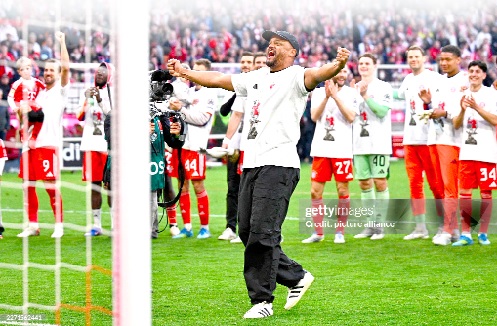 Bayern Munich coach Vincent Kompany on cloud nine as he leads the celebrations at the Allianz Arena yesterday