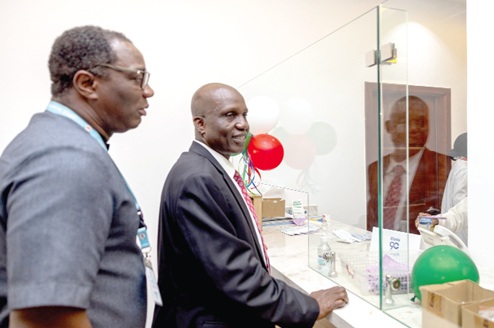 Dr Yakubu Seidu Adam (right), CEO of Korle Bu, and Dr Charles Ofei-Palm, the Director of Pharmacy of Korle Bu, observing how the  24-hour Pharmacy operates
