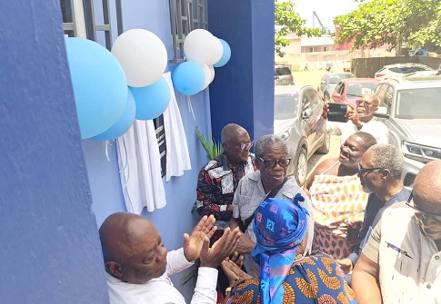 Nana Joojo Solomon (left), President of NAFAG, Samuel Nii Tackie (2nd from right), Head of Nii Nokwei Tackie Weku, and Simon Agah (right), former Vice-President of NAFAG, unveiling the plaque to inaugurate the renamed NAFAG Hall  