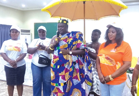 Nana Kwame Nnuro Agyapong II, Chief of Nyamekrom, launching the association while Philomina Boakye (right), President of the Royal Bakers and Flour Users Association, and other executive members look on