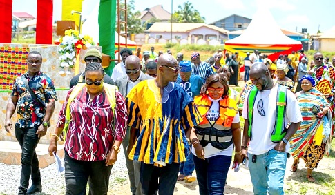 Faustilove Appiah Kannin (left), MCE for Obuasi, with other officials after inaugurating the projects