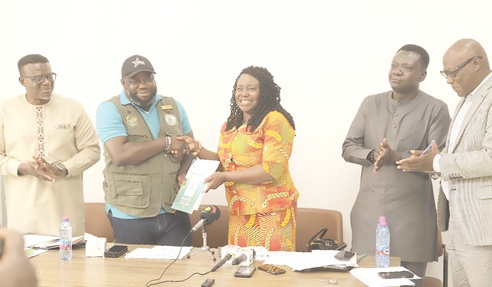 Rita Odoley Sowah (3rd from right), Deputy Minister of Local Government, Chieftaincy and Religious Affairs, presenting the zoning guidelines and planning standards manual to Michael Kpakpo Allotey (2nd from left), Chief Executive of Accra Metropolitan Assembly, during the meeting. Looking on are Dr Kwadwo Yeboah (left), Chief Executive Officer, LUSPA, and other dignitaries. Picture: EDNA SALVO KOTEY