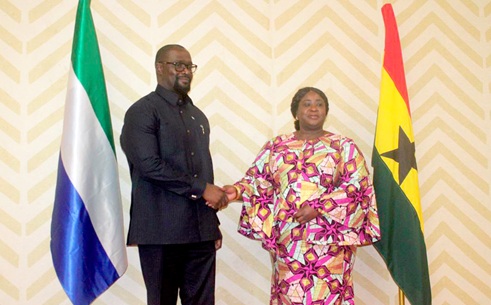 The two Co-Chairs of the Permanent Joint Commission for Cooperation, Kadidja Iddrisu (right), the Chief Director at the Ministry of Foreign Affairs, in a handshake with Alan C. E. Logan, the Sierra Leone’s Director General of the MFA and International Cooperation, after the opening session