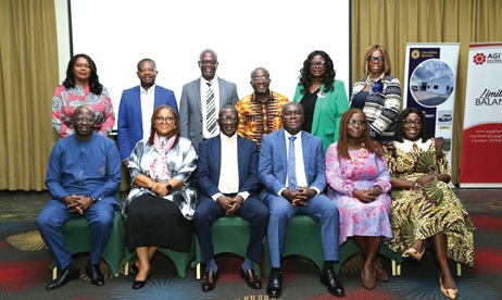 Fred Asiamah-Koranteng (seated 3rd from right), Head, Collateral Registry Department, with Kofi Nsiah-Poku (seated left), President, AGI; Dr Grace Amey-Obeng (seated 2nd from left), Chairperson, AGI Women in Business; Franklin Beinye (seated 3rd from left), Advisor to the Governor, BoG, and other dignitaries after the opening of the workshop.