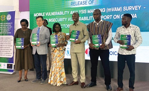 Dr Alhassan Iddrisu (3rd from right), Government Statistician; Dr Philomena Nyarko (3rd from left), a board member of GSS and former Government Statistician; Aurore Rusiga (left), World Food Programme Country Director; Donghyun Lee (2nd from left), Country Director of KOICA, and two others launching the Mobile Vulnerability Analysis and Mapping Food Insecurity Report