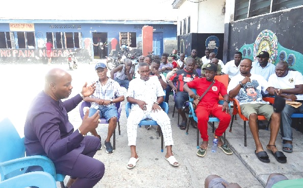 Ivan Bruce-Cudjoe (left) explaining his vision and plans to stakeholders at the famous Attoh Quarshie Gym in Accra
