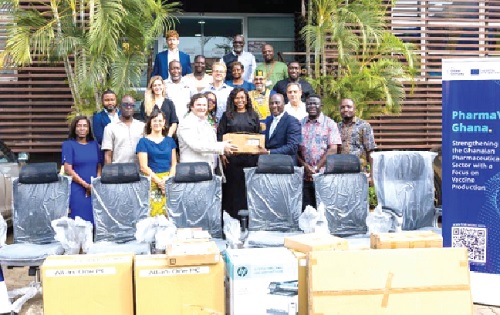 Timothy Dolan, Team Leader, EU Delegation to Ghana, handing over the items to Dr Samuel Tobbin (3rd from right), President of PMAG. With them are some executive members of the associations and partners