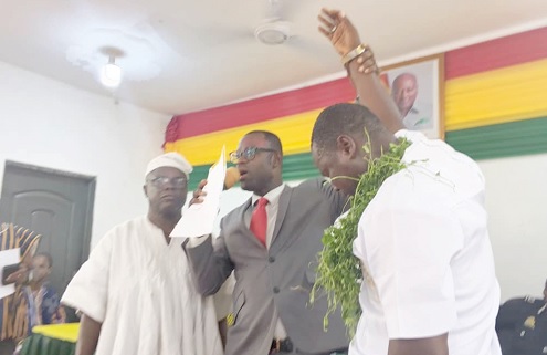 Manasseh Ofosuhene Asante (middle), Tema Metropolitan Director of the EC, declaring Agabby Sumaila Adjetey as the newly elected Tema East Sub Metro Chairman