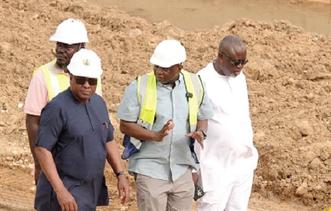 Kwame Governs Agbodza (2nd from right), Minister of Roads and Highways, briefing President John Dramani Mahama (left) on the progress of work on the Kasoa-Winneba corridor. RIGHT: The Winneba junction interchange