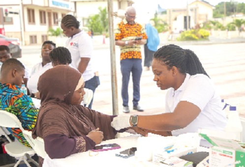 A patron of the CBG free health screening exercise, receiving attention 