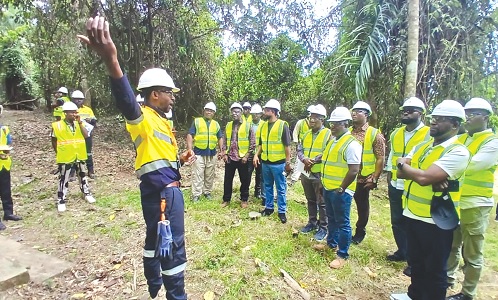 Kwame Obeng Dapaah, Environmental Manager of Zijin Akyem Golden Ridge Limited, explaining the biodiversity of the company to the committee
