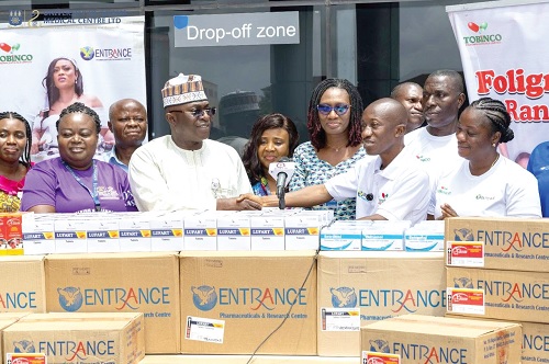 Dr Christopher Mensah (2nd from right), Managing Director of TPL, presenting the drugs to Dr Abdul-Samed Tanko, Chief Executive Officer of UGMC