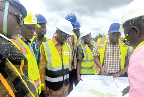 Project managers explaining a point to the GPHA/GSA delegation at Boankra
