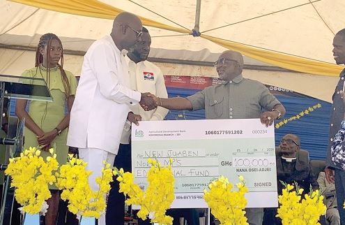 Nana Osei-Adjei (left), PM for New Juaben North, presenting a cheque for GH¢100,000 as the seed capital to Prof. Kwaku Asante, the Scholarship Scheme Manager