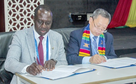 Prof. Samuel A. Atintono (left), Principal, Accra College of Education, and Prof. Zhu Xudong, Dean, Faculty of Education, Beijing Normal University, signing the agreement. Picture: ERNEST KODZI