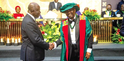 Mr Alex Dadey (right) being congratulated by Otumfuo