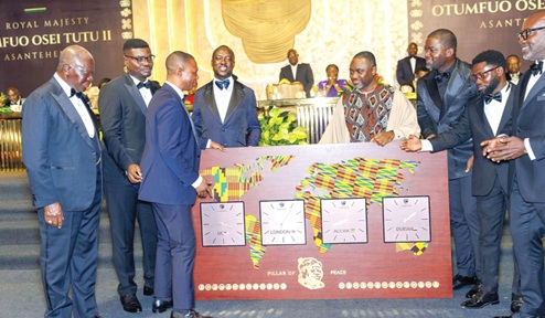 Mr Nick Danso Adjei  (3rd from left) admiring the 14-ounce artworks