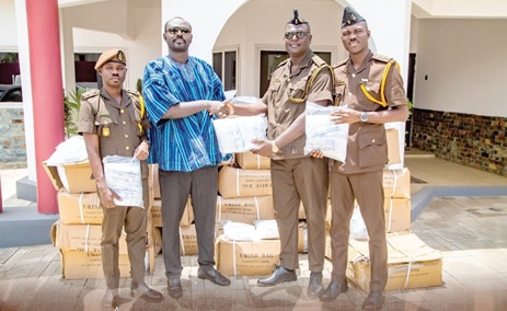 Supt Samuel Kofi Opoku (in smock) making the presentation to the Ghana Prisons Medicine and Equipment Bank